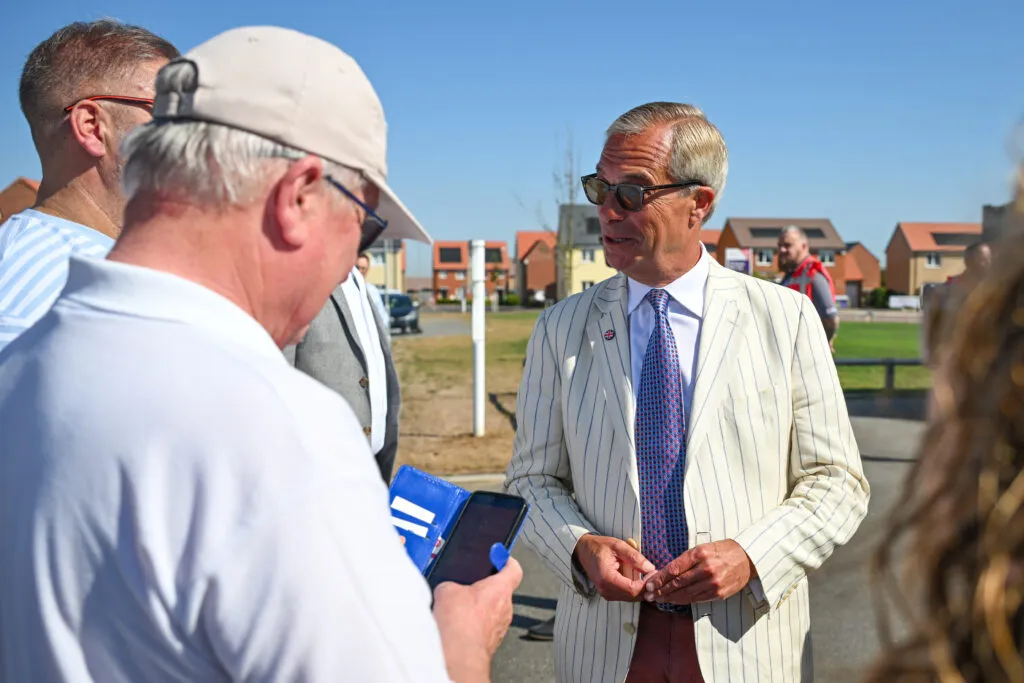 Farage greeting ordinary voters while the media frames the story as a circus