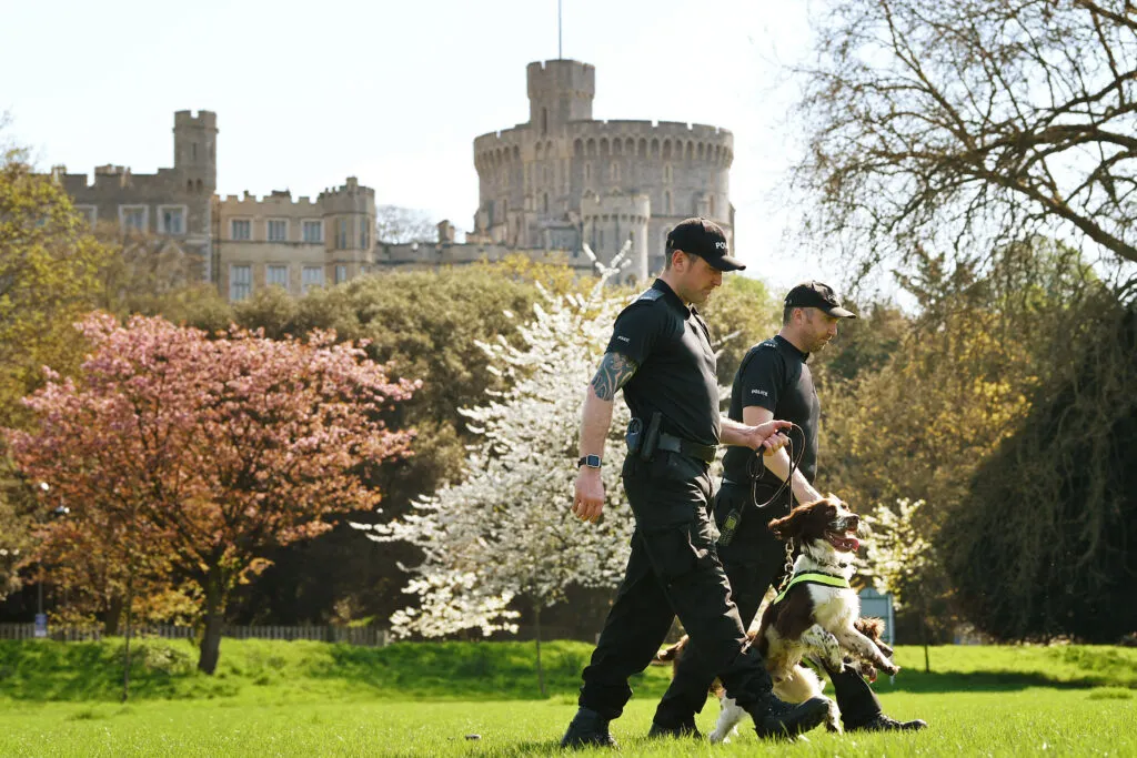 PC Jim Hyman with Yury and PC Paul Shutler with Gus of Thames Valley Police Joint Operations Dog Unit as security preparations began ahead of Prince Harry and Meghan Markle’s wedding in 2018